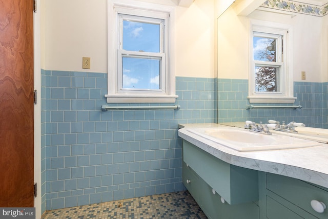 bathroom featuring vanity, tile patterned floors, and tile walls