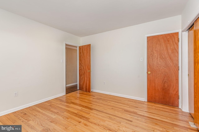 spare room featuring light wood-type flooring