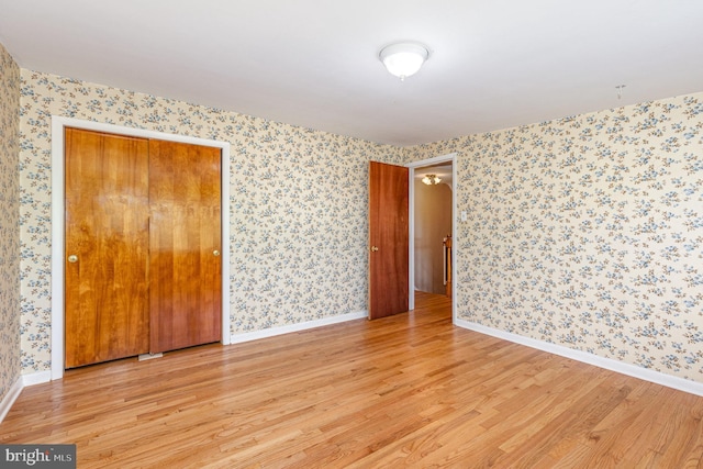 spare room with light hardwood / wood-style flooring