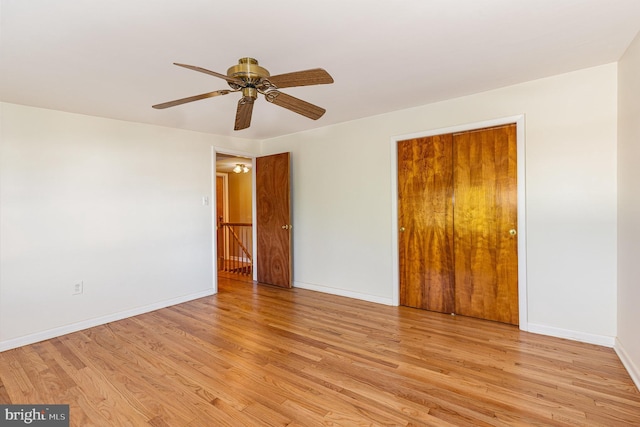 unfurnished room featuring light wood-type flooring and ceiling fan