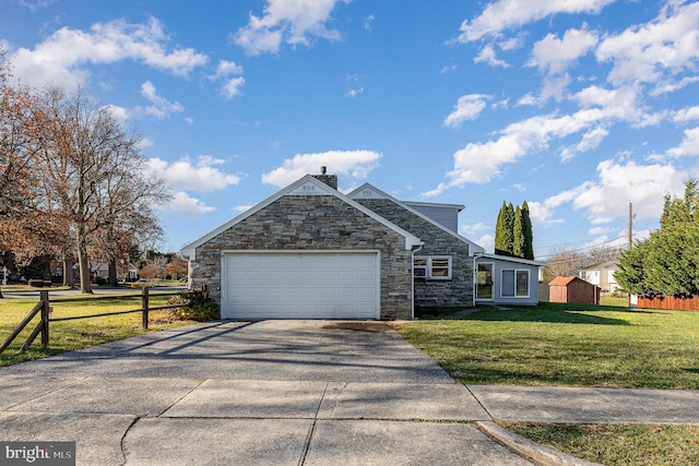 view of front of property with a garage and a front lawn