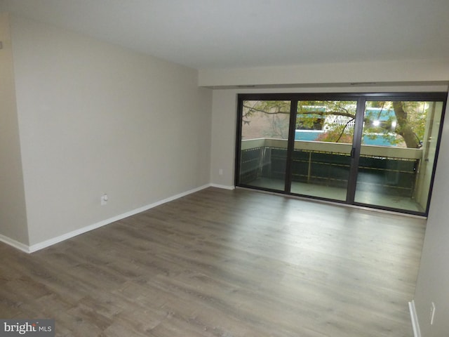 empty room with wood-type flooring