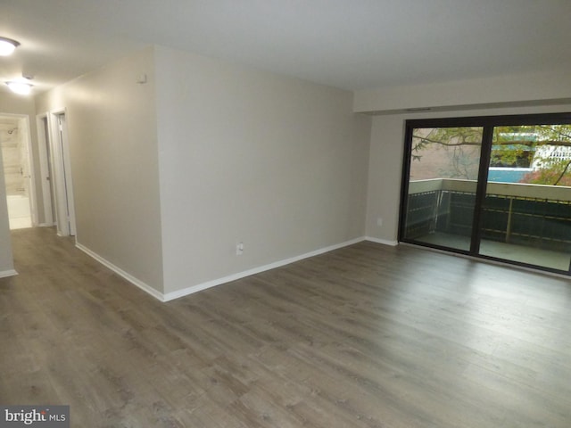 unfurnished room featuring hardwood / wood-style floors