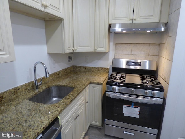 kitchen featuring white cabinetry, sink, and appliances with stainless steel finishes