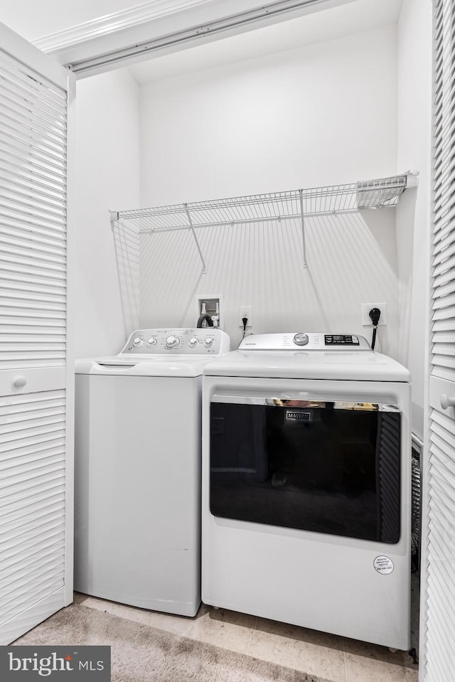 washroom with separate washer and dryer