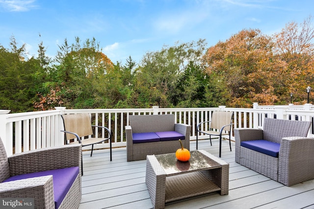 wooden terrace featuring an outdoor hangout area