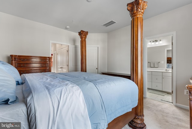 8510 Randell Ridge Rd, Frederick, MD 21704 - bedroom featuring light carpet, decorative columns, and ensuite bathroom