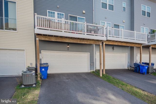 8510 Randell Ridge Rd, Frederick, MD 21704 - rear view of property with a garage, central AC, and asphalt driveway