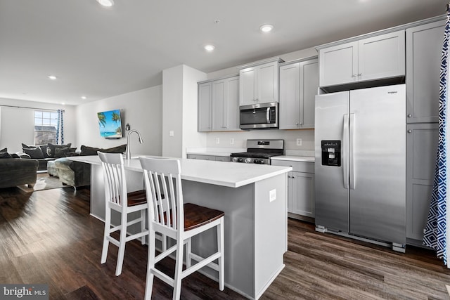 8510 Randell Ridge Rd, Frederick, MD 21704 - kitchen with stainless steel appliances, dark wood finished floors, a kitchen island with sink, light countertops, and recessed lighting