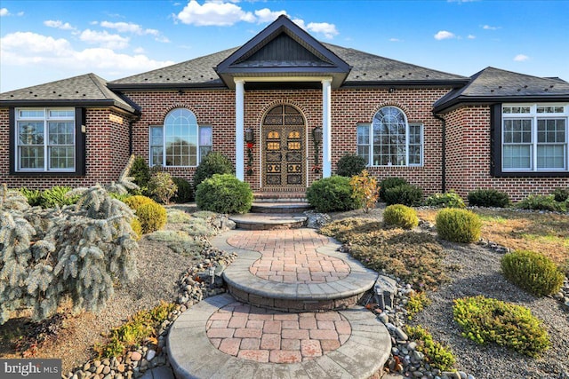 view of front of property featuring brick siding