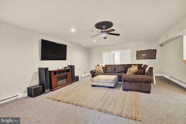 carpeted living room with ceiling fan and a baseboard heating unit