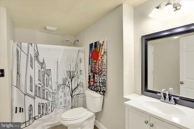 2880 Chestnut Hill Rd, Pottstown, PA 19465 - bathroom with toilet, vanity, curtained shower, and baseboards