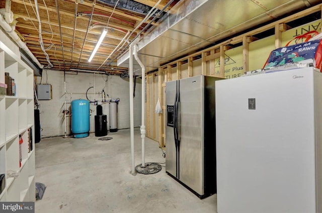 basement featuring electric panel, stainless steel fridge with ice dispenser, and white fridge