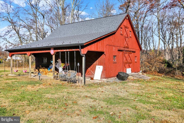 view of outdoor structure featuring a yard