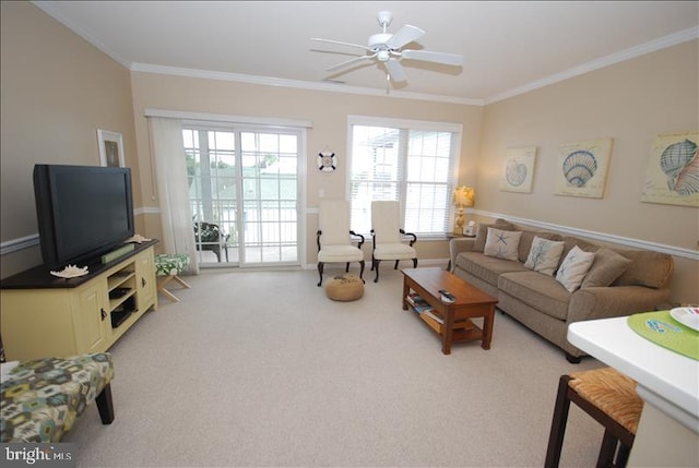 living room with light carpet, ceiling fan, and crown molding