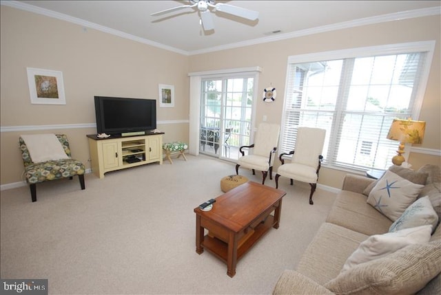 living room with a wealth of natural light, light carpet, and crown molding