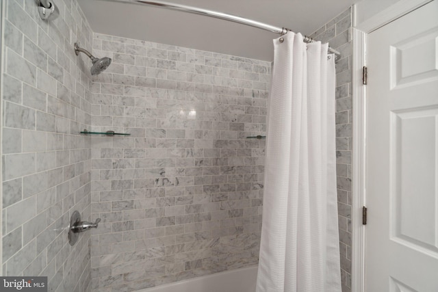 bathroom with shower / bathtub combination with curtain