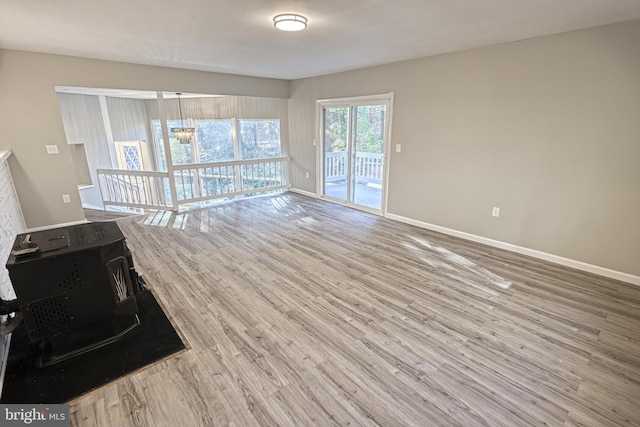 unfurnished living room featuring hardwood / wood-style flooring