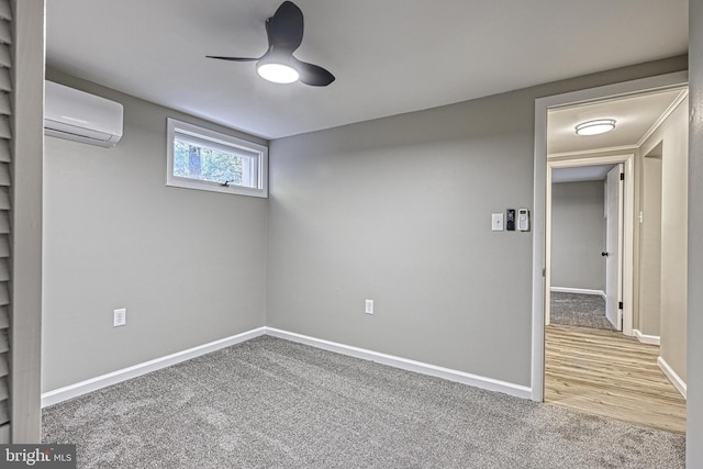 interior space featuring hardwood / wood-style floors, ceiling fan, and an AC wall unit