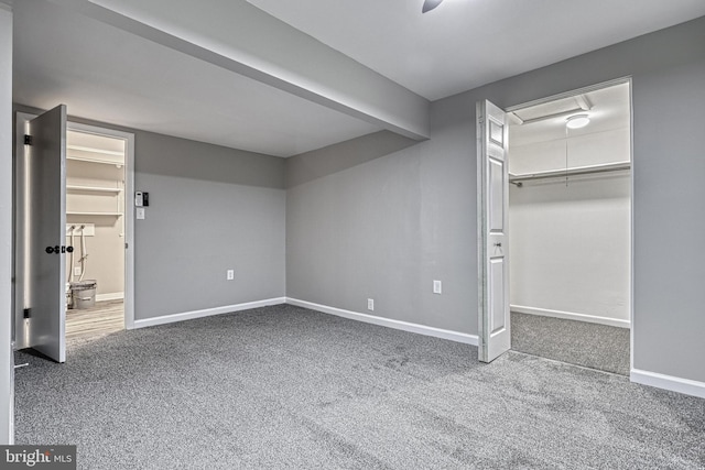 unfurnished bedroom with carpet floors and a closet