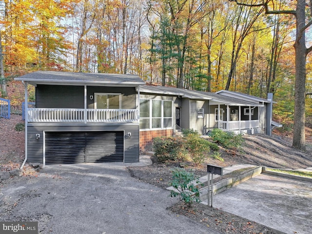 view of front facade with a garage and a porch