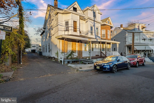 view of property with a porch