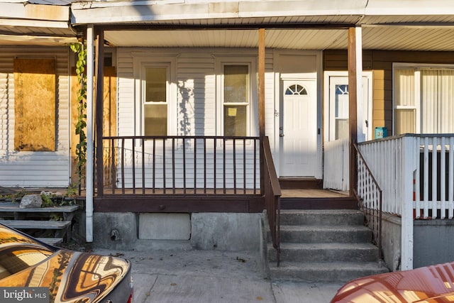 view of exterior entry featuring a porch