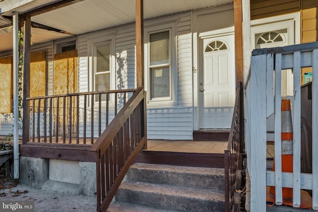 view of exterior entry featuring a porch