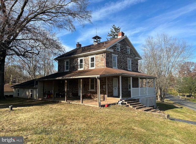 country-style home with a front yard