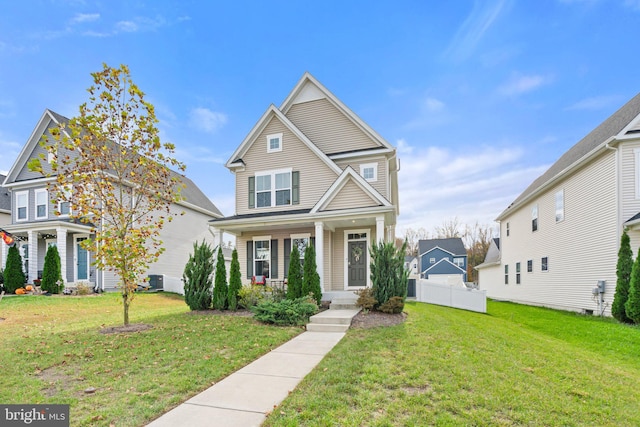 front of property with covered porch and a front lawn