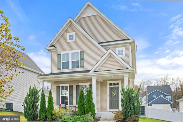 front of property with central air condition unit and covered porch