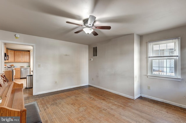 spare room featuring ceiling fan and light wood-type flooring