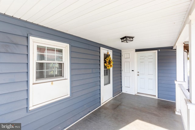 doorway to property featuring covered porch