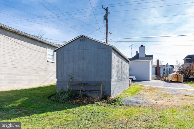 view of outdoor structure featuring a lawn