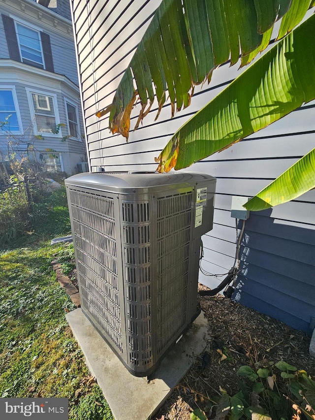 exterior details with wooden walls and cooling unit