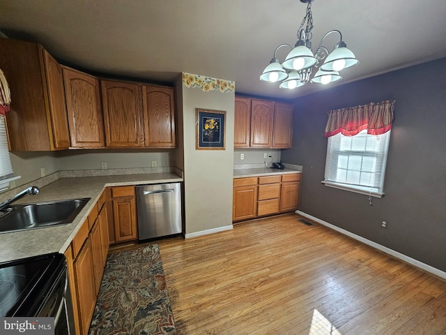 kitchen featuring dishwasher, sink, a notable chandelier, decorative light fixtures, and light wood-type flooring