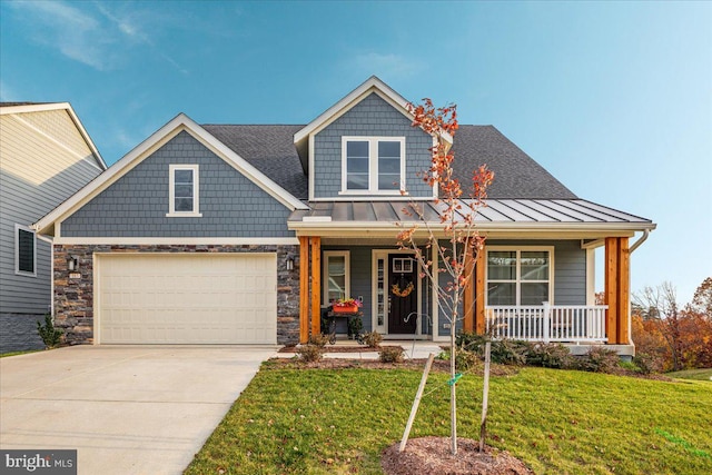 view of front of property with covered porch and a front lawn