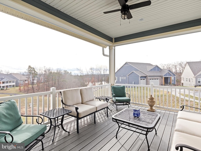 deck featuring an outdoor living space and ceiling fan