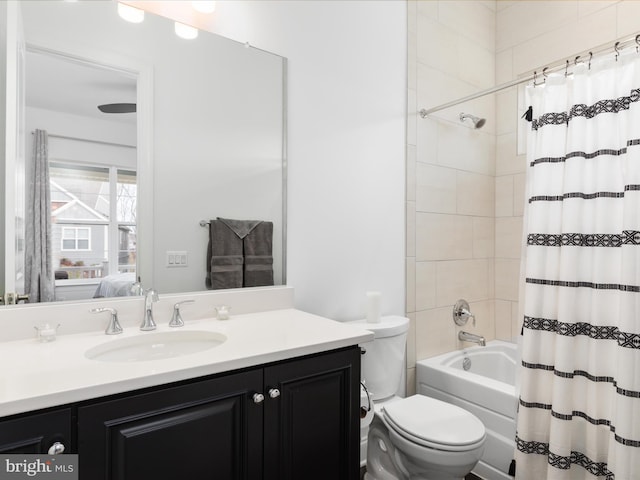 full bathroom featuring vanity, shower / bath combo, and toilet