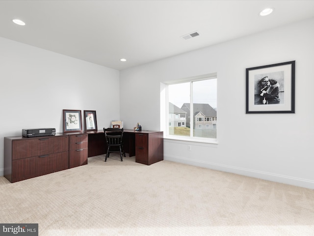 home office with light colored carpet