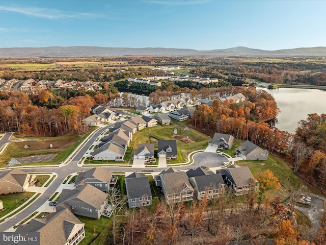 bird's eye view with a water and mountain view