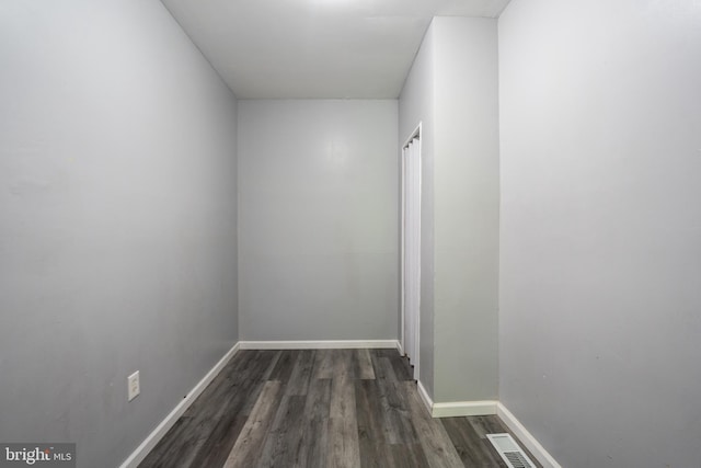 corridor with dark wood-type flooring