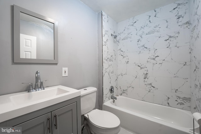 full bathroom featuring vanity, toilet, and tiled shower / bath combo