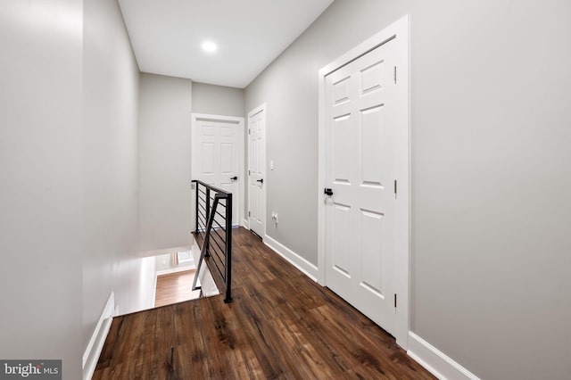 hallway featuring dark hardwood / wood-style floors