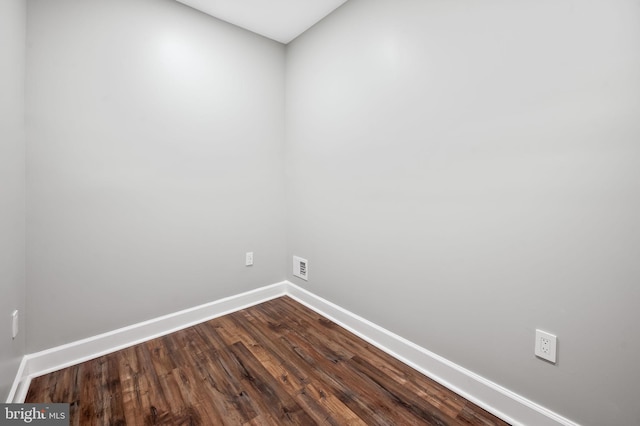 spare room with hardwood / wood-style floors