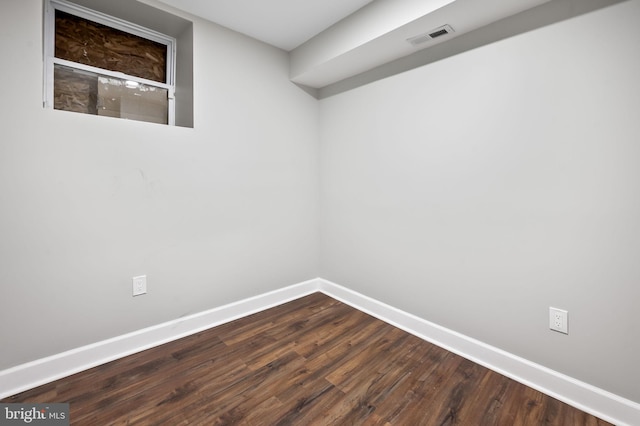 spare room with hardwood / wood-style floors