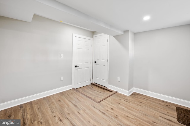 basement featuring light hardwood / wood-style flooring