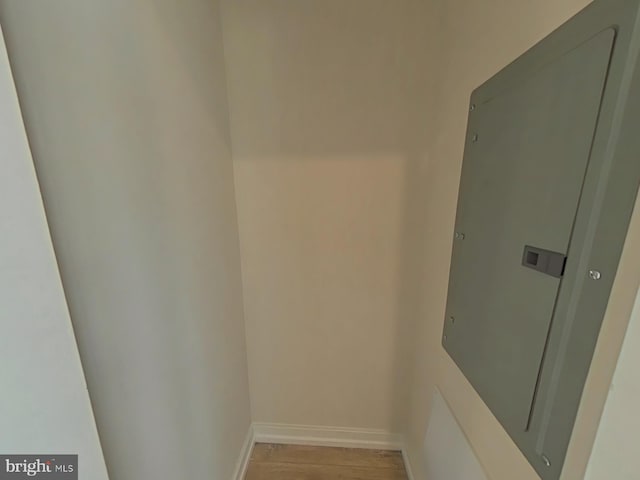 bathroom with hardwood / wood-style floors and electric panel