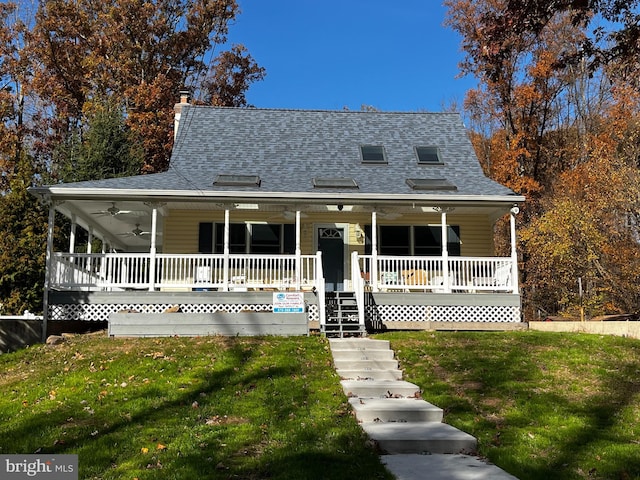 farmhouse with a porch and a front yard