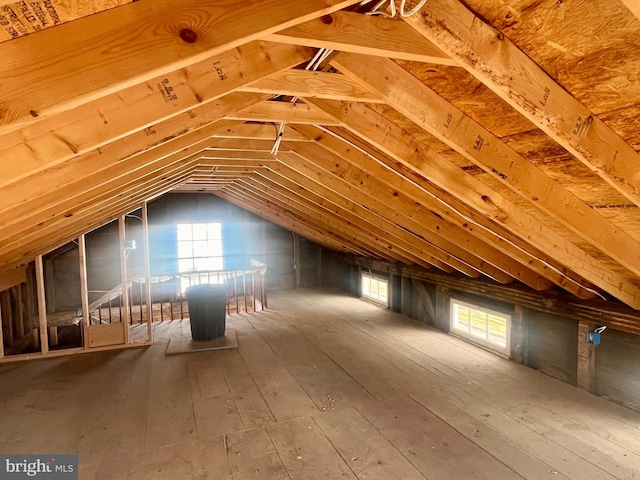 unfinished attic featuring a healthy amount of sunlight